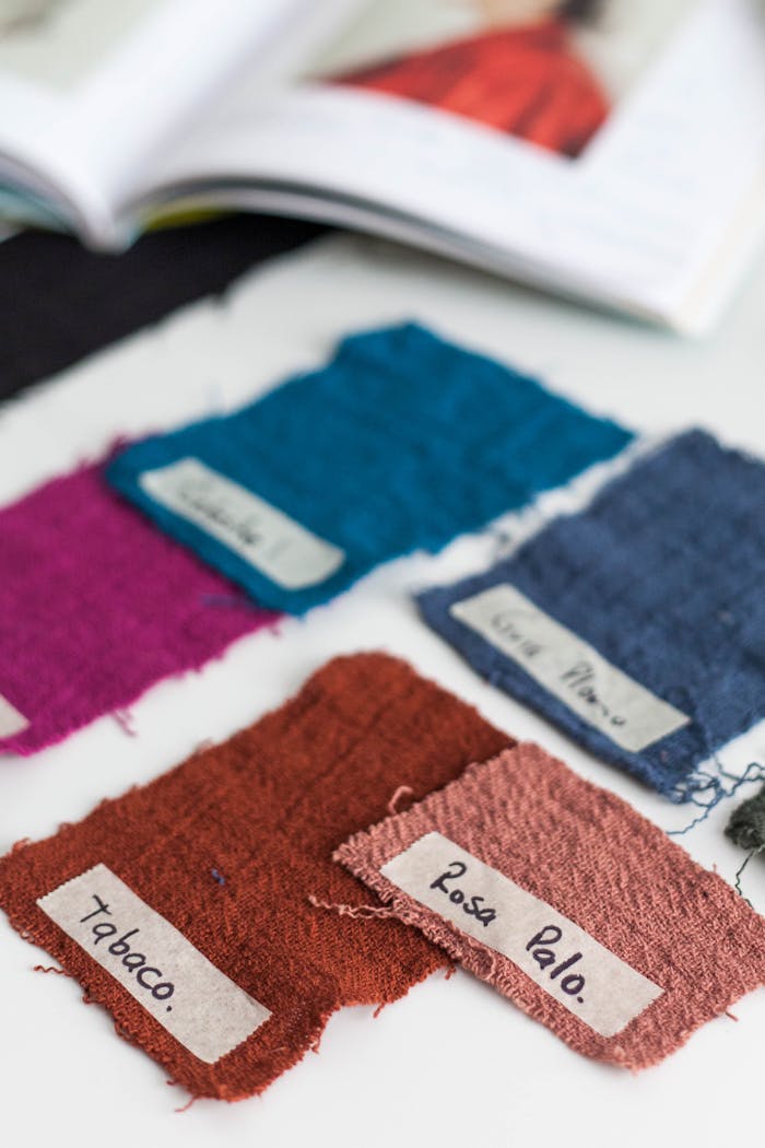 A collection of colorful fabric swatches labeled for textile design inspiration and creativity.